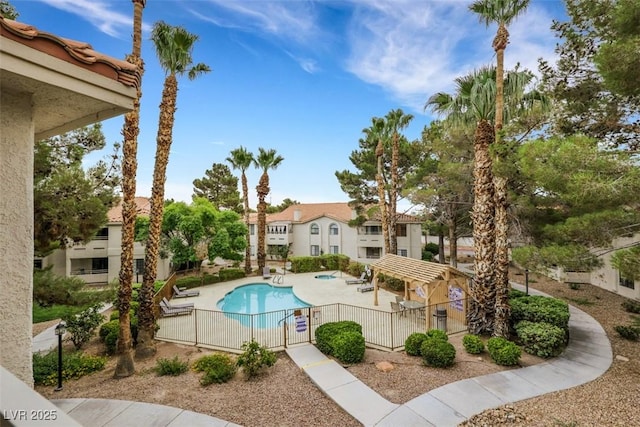2627 S Durango Dr Unit 201, Las Vegas, NV 89117 - community pool featuring a patio area