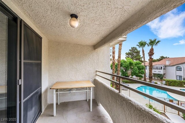 2627 S Durango Dr Unit 201, Las Vegas, NV 89117 - balcony featuring view of pool area