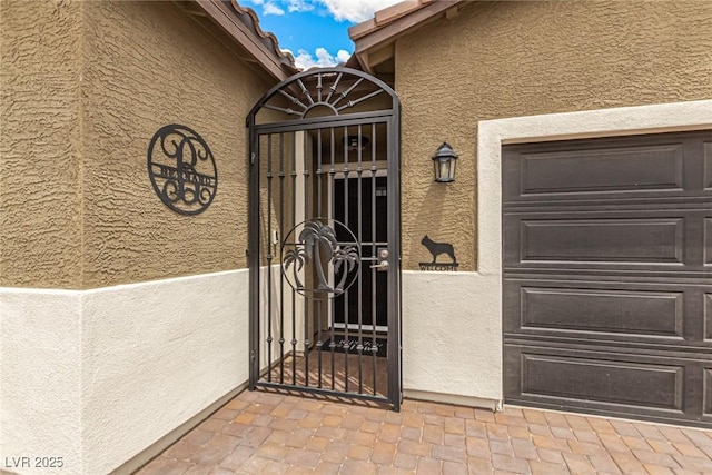 146 E Hawk Ave, Pahrump, NV 89060 - property entrance featuring stucco siding and a gate