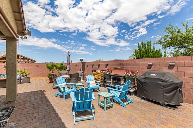 146 E Hawk Ave, Pahrump, NV 89060 - fenced backyard featuring area for grilling and a patio area