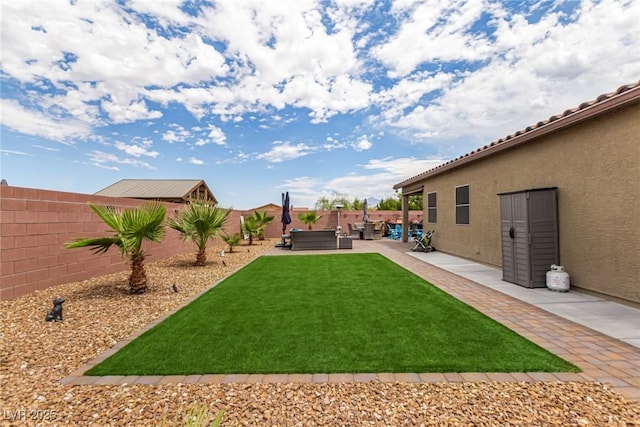 146 E Hawk Ave, Pahrump, NV 89060 - fenced backyard with outdoor lounge area and a patio