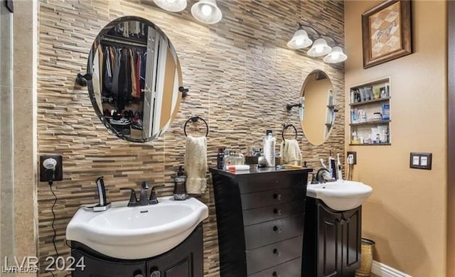 2253 Van Gogh Dr, Henderson, NV 89074 - full bath with two vanities and baseboards