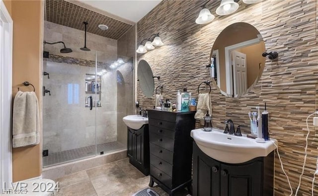 2253 Van Gogh Dr, Henderson, NV 89074 - full bathroom with a shower stall, two vanities, and tile patterned floors
