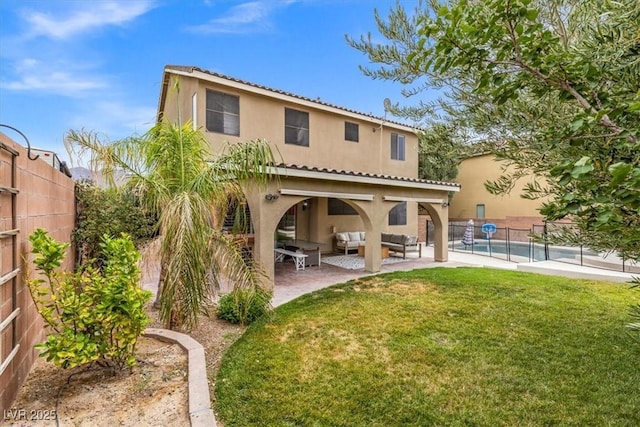 8929 Monte Oro Dr, Las Vegas, NV 89131 - back of house with an outdoor living space, stucco siding, and a fenced backyard