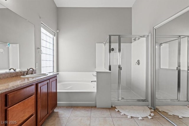 8929 Monte Oro Dr, Las Vegas, NV 89131 - full bath featuring a stall shower, a garden tub, and tile patterned flooring