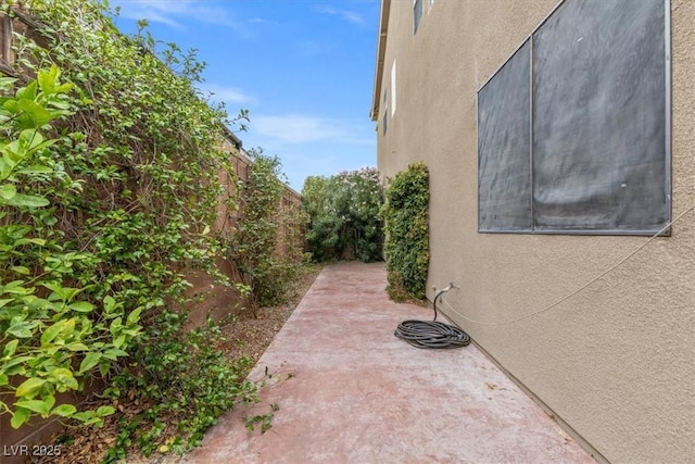 8929 Monte Oro Dr, Las Vegas, NV 89131 - view of property exterior with stucco siding, a fenced backyard, and a patio area
