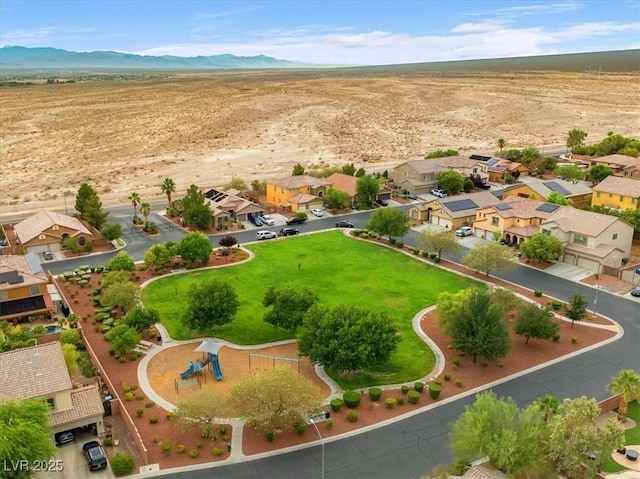8929 Monte Oro Dr, Las Vegas, NV 89131 - aerial view of sparsely populated area featuring a mountain backdrop and nearby suburban area