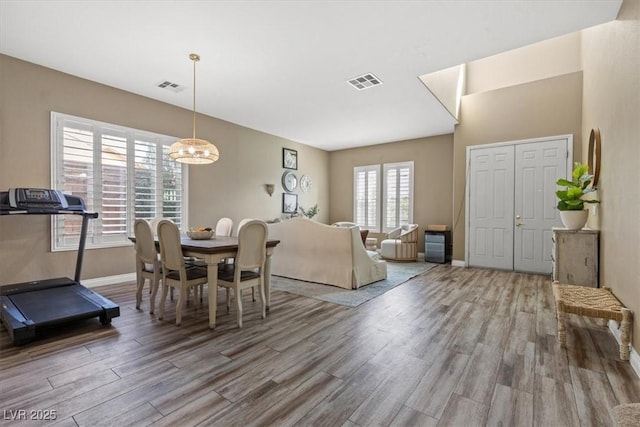 8929 Monte Oro Dr, Las Vegas, NV 89131 - dining area featuring wood finished floors and a chandelier