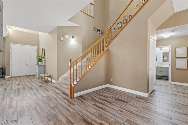 8929 Monte Oro Dr, Las Vegas, NV 89131 - entryway with wood finished floors, stairway, and a towering ceiling