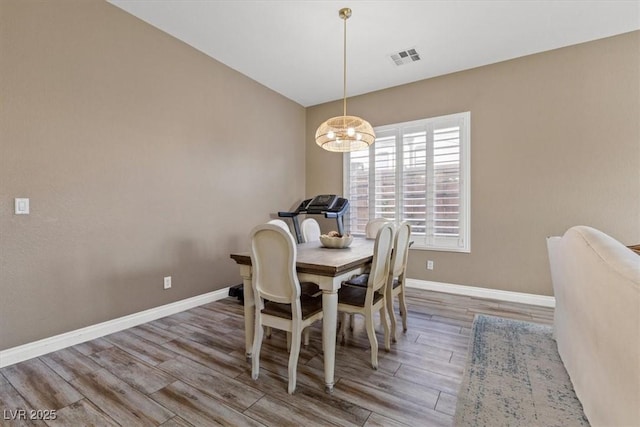 8929 Monte Oro Dr, Las Vegas, NV 89131 - dining space featuring wood finished floors and a chandelier