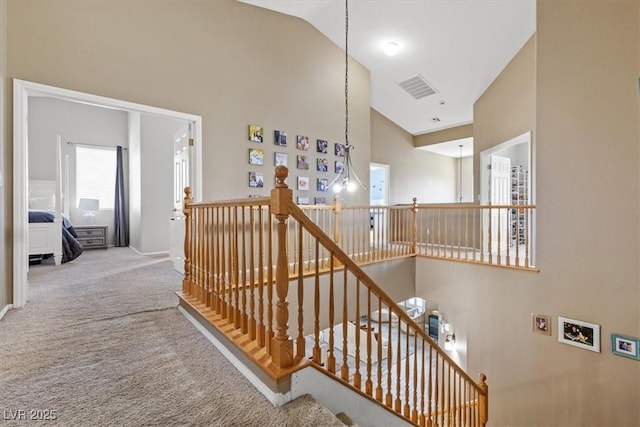 8929 Monte Oro Dr, Las Vegas, NV 89131 - stairs with carpet and high vaulted ceiling