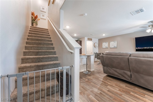 2620 Canary Yellow Ct, North Las Vegas, NV 89086 - stairs featuring a ceiling fan, wood finished floors, and recessed lighting