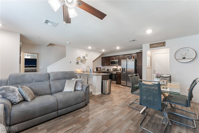 2620 Canary Yellow Ct, North Las Vegas, NV 89086 - living area with ceiling fan, light wood-style flooring, and recessed lighting