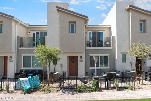 2620 Canary Yellow Ct, North Las Vegas, NV 89086 - view of property featuring a balcony, stucco siding, and a patio