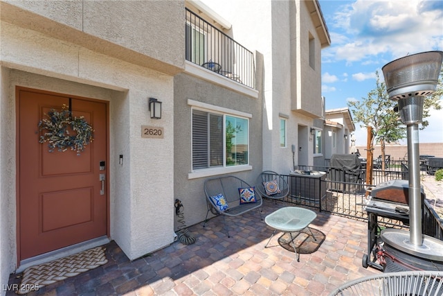 2620 Canary Yellow Ct, North Las Vegas, NV 89086 - doorway to property featuring stucco siding and a patio