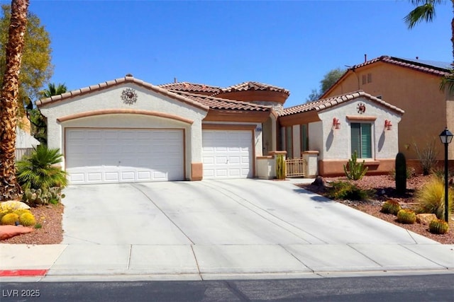 11240 Romette Ct, Las Vegas, NV 89141 - mediterranean / spanish house featuring an attached garage, stucco siding, driveway, and a tile roof
