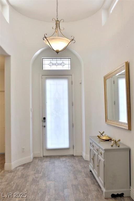 11240 Romette Ct, Las Vegas, NV 89141 - entrance foyer with arched walkways and light wood-style floors