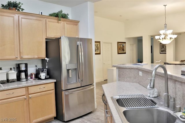 11240 Romette Ct, Las Vegas, NV 89141 - kitchen with stainless steel fridge with ice dispenser, a chandelier, light brown cabinets, and light countertops