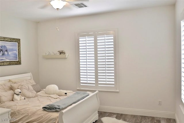 11240 Romette Ct, Las Vegas, NV 89141 - bedroom featuring wood finished floors and multiple windows