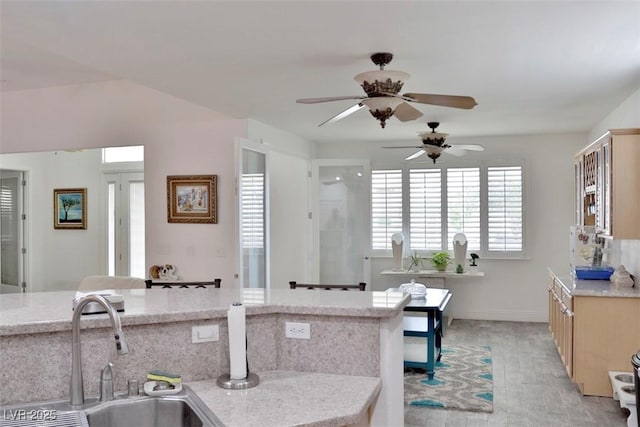 11240 Romette Ct, Las Vegas, NV 89141 - kitchen with ceiling fan and light wood-style floors