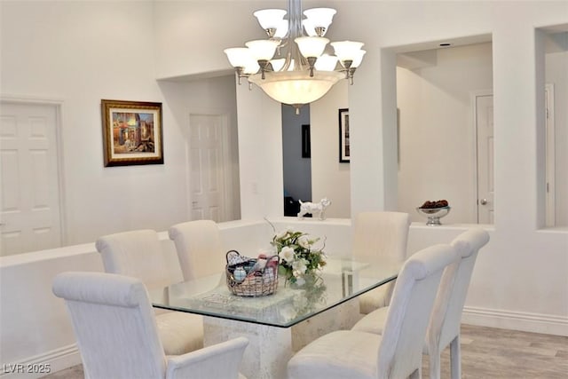11240 Romette Ct, Las Vegas, NV 89141 - dining area featuring a chandelier and light wood-style floors