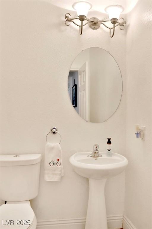 11240 Romette Ct, Las Vegas, NV 89141 - bathroom featuring toilet and baseboards