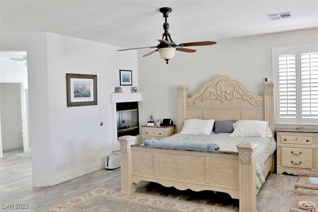 11240 Romette Ct, Las Vegas, NV 89141 - bedroom with light wood-style flooring and ceiling fan