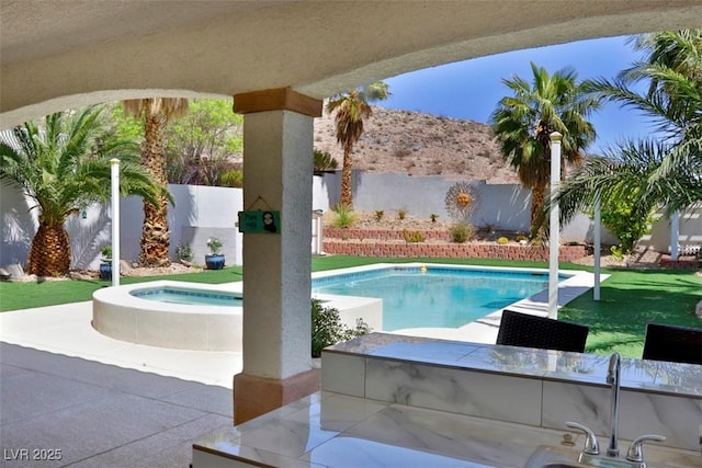 11240 Romette Ct, Las Vegas, NV 89141 - view of pool with an in-ground hot tub, a fenced backyard, and a patio area