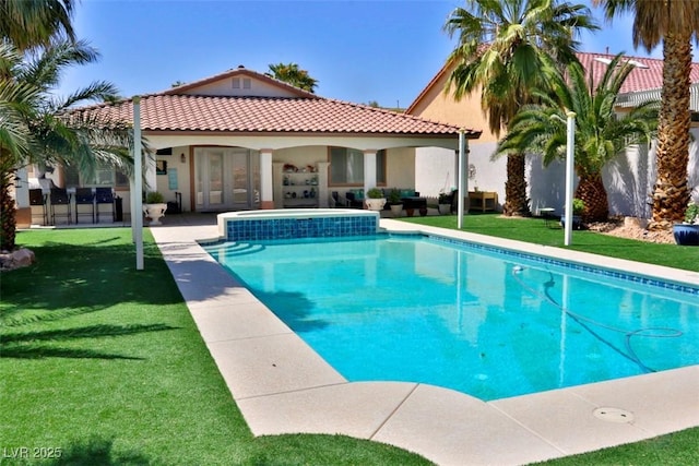 11240 Romette Ct, Las Vegas, NV 89141 - swimming pool with a lawn, a patio area, and french doors