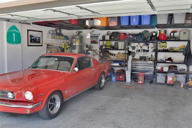 11240 Romette Ct, Las Vegas, NV 89141 - garage featuring strapped water heater and a garage door opener