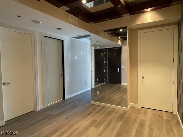 4575 Dean Martin Dr Unit 705, Las Vegas, NV 89103 - unfurnished room with wood finished floors, coffered ceiling, and beam ceiling