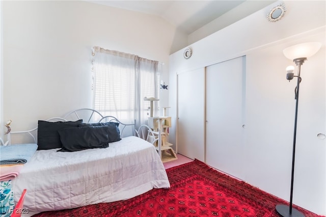4542 Silver Bit Ct, North Las Vegas, NV 89032 - carpeted bedroom with a closet and vaulted ceiling