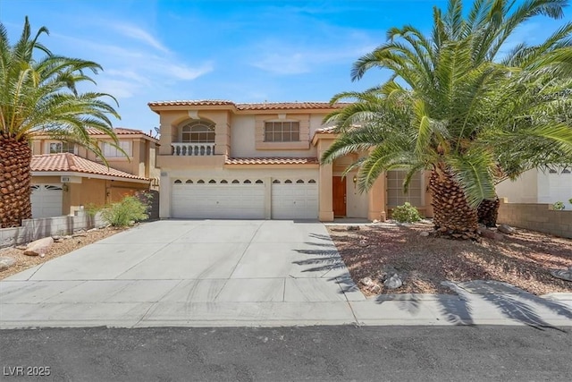 9824 Babys Breath Ct, Las Vegas, NV 89183 - mediterranean / spanish-style house with stucco siding, a garage, driveway, and a tile roof