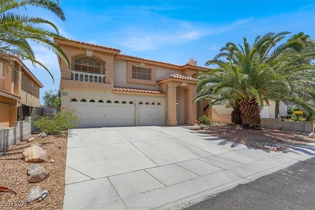 9824 Babys Breath Ct, Las Vegas, NV 89183 - mediterranean / spanish home with stucco siding, driveway, an attached garage, a tile roof, and a chimney