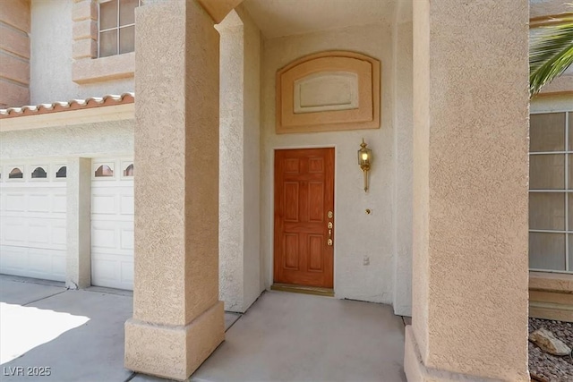 9824 Babys Breath Ct, Las Vegas, NV 89183 - entrance to property with stucco siding and a garage