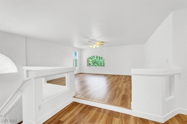 9824 Babys Breath Ct, Las Vegas, NV 89183 - unfurnished living room featuring ceiling fan and wood finished floors