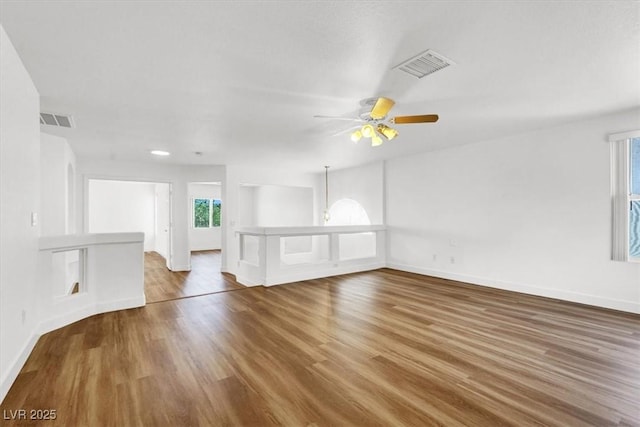 9824 Babys Breath Ct, Las Vegas, NV 89183 - unfurnished living room featuring wood finished floors and ceiling fan
