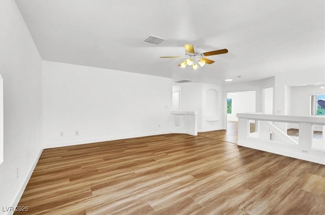 9824 Babys Breath Ct, Las Vegas, NV 89183 - unfurnished living room featuring a ceiling fan and wood finished floors