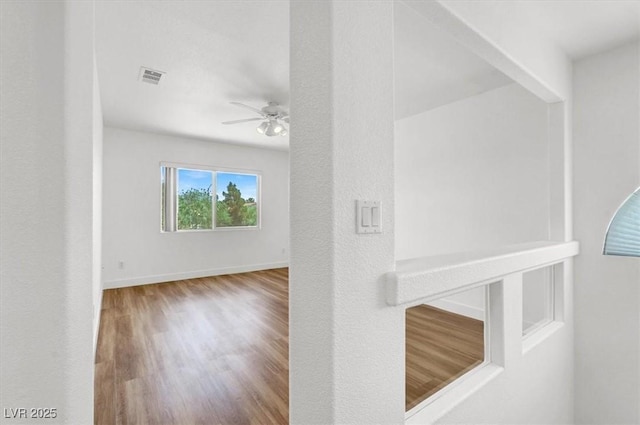 9824 Babys Breath Ct, Las Vegas, NV 89183 - corridor with wood finished floors and baseboards
