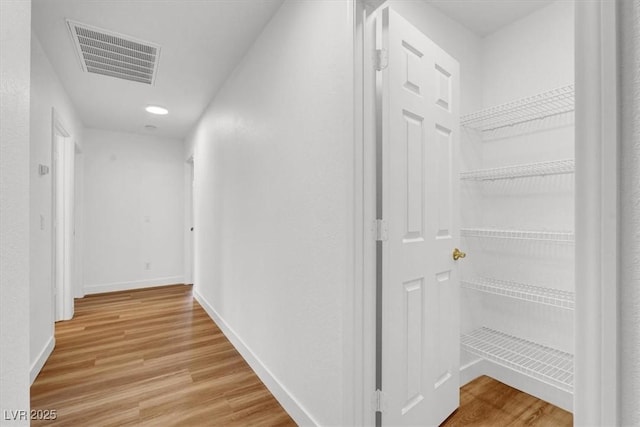 9824 Babys Breath Ct, Las Vegas, NV 89183 - hallway with light wood-style flooring and baseboards