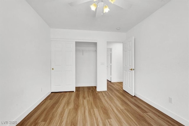 9824 Babys Breath Ct, Las Vegas, NV 89183 - unfurnished bedroom featuring wood finished floors, a closet, and a ceiling fan
