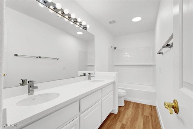 9824 Babys Breath Ct, Las Vegas, NV 89183 - full bath with double vanity, wood finished floors, bathing tub / shower combination, and recessed lighting