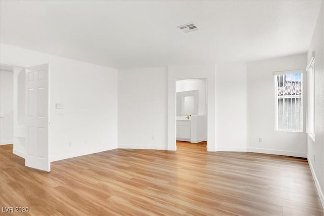 9824 Babys Breath Ct, Las Vegas, NV 89183 - empty room with light wood-type flooring and baseboards