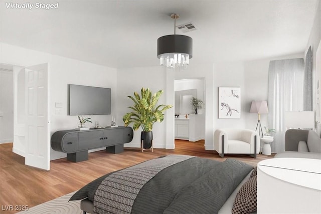 9824 Babys Breath Ct, Las Vegas, NV 89183 - living area featuring wood finished floors and a chandelier