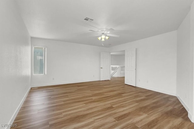 9824 Babys Breath Ct, Las Vegas, NV 89183 - empty room with a ceiling fan and light wood finished floors