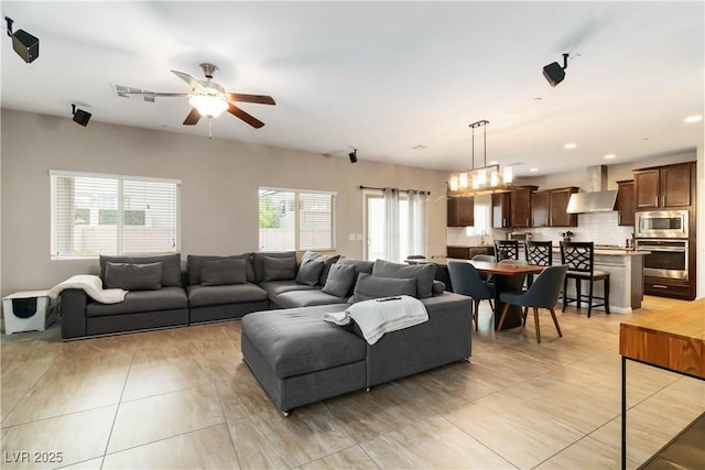 176 Dunblane St, Henderson, NV 89012 - living area featuring ceiling fan and light tile patterned floors