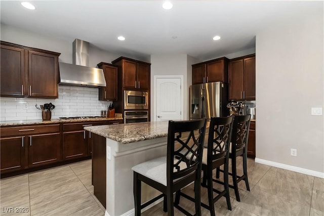 176 Dunblane St, Henderson, NV 89012 - kitchen with wall chimney exhaust hood, appliances with stainless steel finishes, a kitchen bar, stone counters, and light tile patterned floors