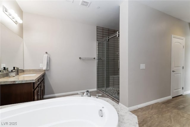 176 Dunblane St, Henderson, NV 89012 - bathroom with vanity, a garden tub, and a shower stall