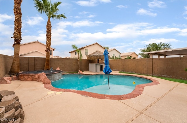 2064 Spiers Ave, Las Vegas, NV 89183 - view of swimming pool with a fenced backyard, a patio, and a pool with connected hot tub