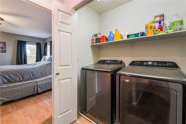 2064 Spiers Ave, Las Vegas, NV 89183 - washroom featuring washer and clothes dryer and light wood-style flooring